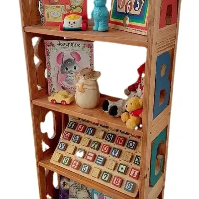 Alphabet carved bookcase with vintage toys
