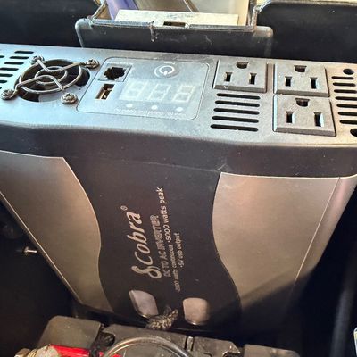 Cobra Inverter with trickle charger in a wheeled tote. 