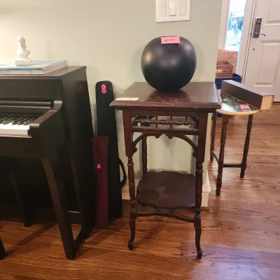 Sale Photo Thumbnail #111: Antique dark wood plant stand or side table with spindle details, displayed alongside an upright digital piano.