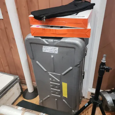 Sale Photo Thumbnail #123: Large grey Arri heavy-duty hard flight case with equipment boxes and a stand, labeled for a tungsten lighting kit.