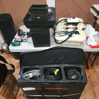 Sale Photo Thumbnail #149: Selection of hydroponics and photography equipment, including a soft-sided carrying bag filled with heavy-duty cables, power supplies, and plastic growing trays.
