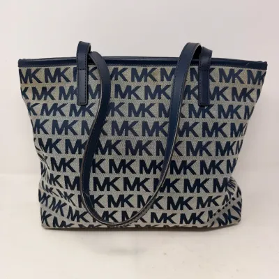 Sale Photo Thumbnail #26: Michael Kors tote bag featuring a navy blue and cream signature logo pattern with dark blue leather shoulder straps and trim.