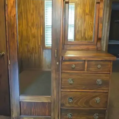 Sale Photo Thumbnail #161: Antique dark wood chifforobe featuring a full-length mirrored cabinet door, five drawers with ornate brass knobs, and an attached top vanity mirror.