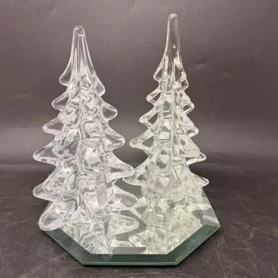 Sale Photo Thumbnail #33: Pair of clear blown-glass evergreen tree figurines mounted on a mirrored hexagonal glass base.
