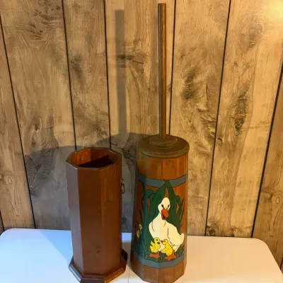 Sale Photo Thumbnail #56: Vintage wooden butter churn-style toilet brush holder featuring a hand-painted duck and ducklings motif, accompanied by a matching plain wooden vessel.