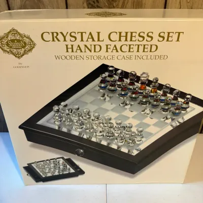 Sale Photo Thumbnail #59: Shannon Crystal by Godinger hand-faceted crystal chess set in its original box with a wooden storage case.
