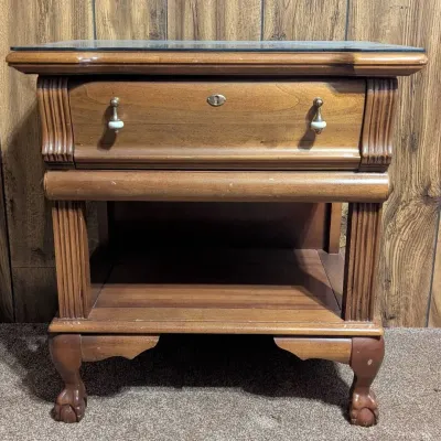 Sale Photo Thumbnail #10: Traditional wooden nightstand featuring a single drawer with teardrop hardware, an open lower shelf, and claw-and-ball feet.