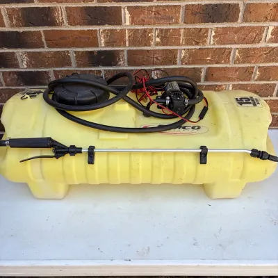 Sale Photo Thumbnail #76: Fimco 15-gallon spot sprayer tank with attached 12V pump, hose, wand, and electrical wiring.