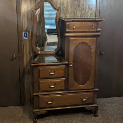 Sale Photo Thumbnail #11: Vintage step-back vanity and dresser combination with attached shaped mirror, glass top surfaces, and claw feet.