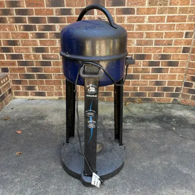 Sale Photo Thumbnail #73: Vintage Char-Broil Electric Patio Caddie grill in blue and black finish, showing light surface wear.