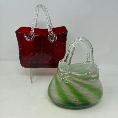 Sale Photo Thumbnail #172: Pair of vintage Murano-style hand-blown glass purse vases, including a deep red controlled-bubble piece and a green and white swirl design.
