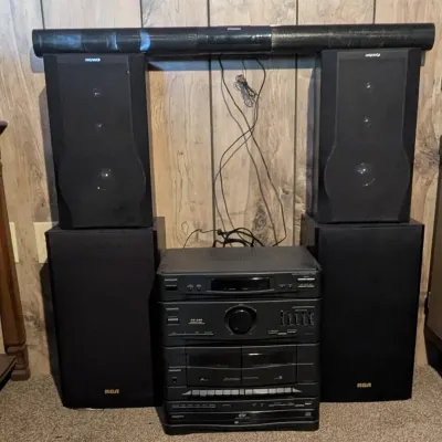 Sale Photo Thumbnail #54: Vintage Magnavox stereo component system with dual cassette deck, CD player, amplifier, and accompanying Magnavox and RCA speakers.