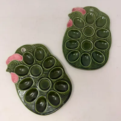 Sale Photo Thumbnail #22: Pair of vintage green glazed ceramic chicken-shaped deviled egg plates with pink comb details and hanging holes.