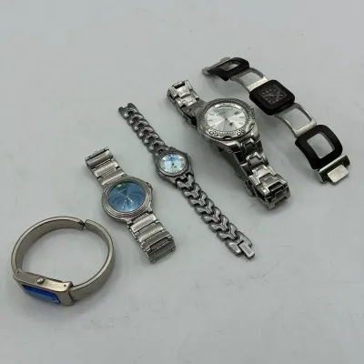 Sale Photo Thumbnail #202: Collection of five fashion wristwatches, including stainless steel Fossil and Relic models, featuring various dial colors and band styles.