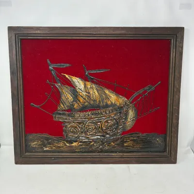 Sale Photo Thumbnail #168: Vintage 3D mixed media sailing ship art depicting a galleon on a red velvet backing, housed in a rustic wooden frame.
