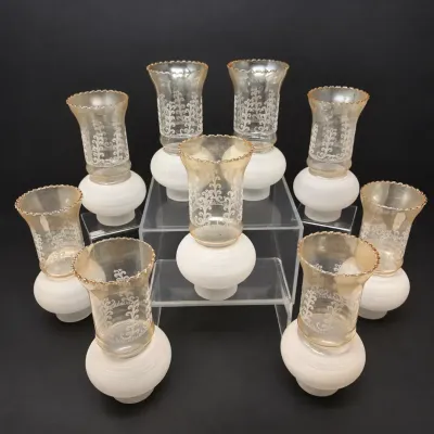 Sale Photo Thumbnail #37: Set of eight vintage frosted and amber-tinted glass hurricane lamp shades featuring etched filigree details and ruffled rims.