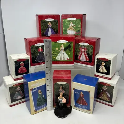 Sale Photo Thumbnail #182: Collection of Hallmark Keepsake Barbie ornaments, featuring various Holiday and Celebration Barbie editions in original packaging alongside an unboxed figurine.