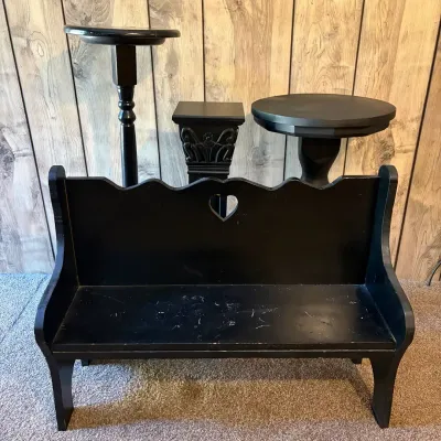 Sale Photo Thumbnail #64: Collection of black painted accent furniture including a wooden bench with a heart cutout, a pedestal stand, a column-style plant stand, and a round accent table.