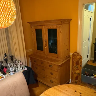 Sale Photo Thumbnail #4: Antique pine two-piece hutch featuring a glass-front display cabinet over a three-drawer base.