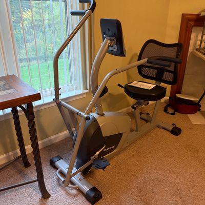 Sale Photo Thumbnail #68: MaxKare stationary recumbent exercise bike featuring moving handlebars, an adjustable mesh seat, and a digital monitor screen.
