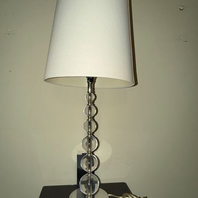 Sale Photo Thumbnail #74: Modern table lamp featuring a stacked clear glass orb column with polished chrome hardware and a tall off-white tapered drum shade.