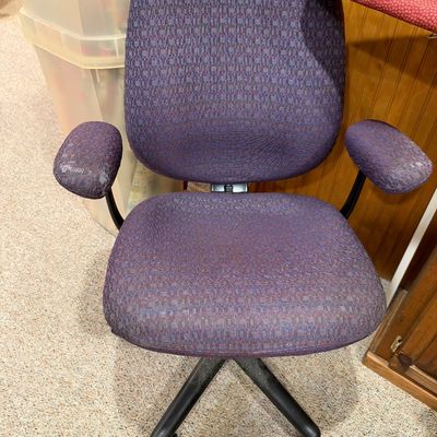 Sale Photo Thumbnail #116: Adjustable swivel office desk chair with purple fabric upholstery and padded armrests, late 1990s to 2000s.