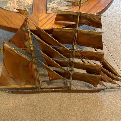 Sale Photo Thumbnail #38: Vintage mid-century copper and brass sailing ship metal wall art, featuring detailed sails and rigging.