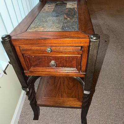 Sale Photo Thumbnail #67: Rustic wood and metal end table featuring a slate tile top inlay, single drawer, and lower shelf.