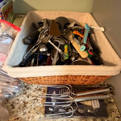 Sale Photo Thumbnail #80: Woven storage basket lined with fabric and filled with an assortment of kitchen utensils, serving pieces, and gadgets.