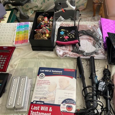Assortment of household goods, including hair styling tools, an Adams Last Will & Testament forms kit, pill organizers, calculators,...