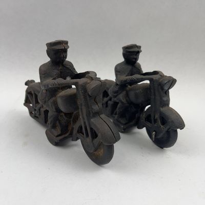 Sale Photo Thumbnail #534: Pair Cast Iron Motorcycle Rider Toys