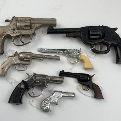 Sale Photo Thumbnail #238: Hubley & Uniwerk Metal Toy Guns