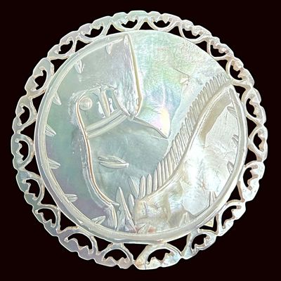 Sale Photo Thumbnail #416: A DIVISION THREE CARVED PEARL PICTORIAL BUTTON