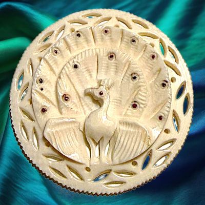 Sale Photo Thumbnail #382: A DIVISION THREE PIERCED & CARVED ANIMAL BUTTON