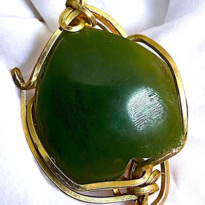 Sale Photo Thumbnail #365: A DIVISION THREE GEMSTONE SET IN GOLD