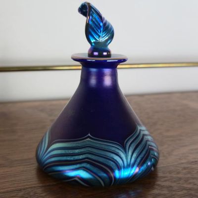 Sale Photo Thumbnail #84: Steven Lundberg Signed Iridescent Blue Art Glass Perfume Bottle With Leaf Stopper – 4"