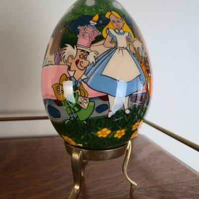 Sale Photo Thumbnail #122: The Vandergrift Collection Alice In Wonderland Decorative Egg With Gold Tone Stand – 7"