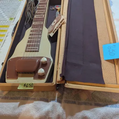 Vintage Gibson lap steel guitar housed in its original wooden hard case.