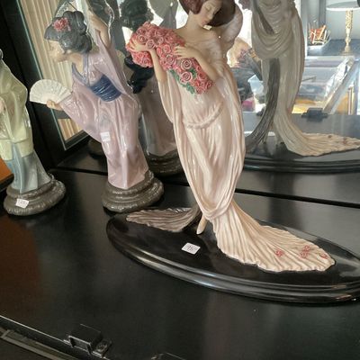 Sale Photo Thumbnail #165: Collection of fine porcelain figurines, including an Art Nouveau style lady holding a bouquet of pink roses 