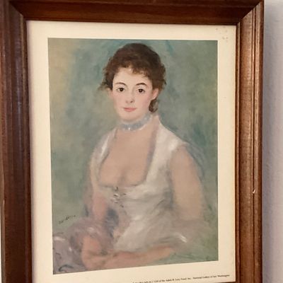 Sale Photo Thumbnail #75: Framed print reproduction of Pierre-Auguste Renoir's portrait of Madame Henriot, set in a dark wood frame with a top brass hanger loop.