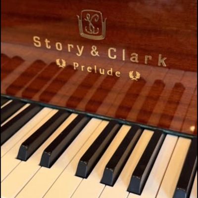 Sale Photo Thumbnail #3: Stunning Story & Clark Prelude baby grand piano has a polished mahogany wood finish. This instrument is a Prelude model with a matching padded bench. The piano has a high-gloss exterior and brass hardware.
Approx 5x5 feet. 
Buyer pays moving costs.