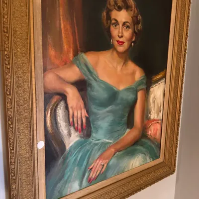 By Delos Palmer, Vintage mid-century oil portrait of a woman in a turquoise off-the-shoulder gown, housed in an ornate gilt gesso frame.