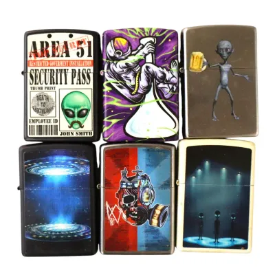 Sale Photo Thumbnail #162: Collection of six Zippo-style metal flip lighters featuring alien, sci-fi, and apocalyptic graphic designs.