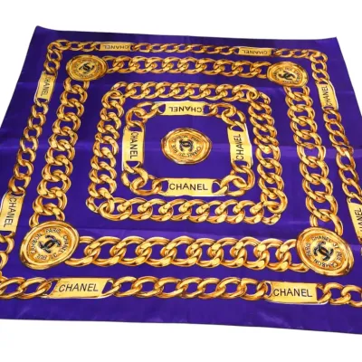 Sale Photo Thumbnail #78: Vintage purple silk scarf featuring a gold chain link motif and medallion detail.