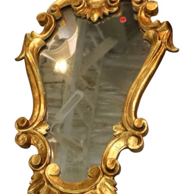 Sale Photo Thumbnail #141: Vintage Rococo-style wall mirror featuring an ornate gilded frame with acanthus leaf accents and scrollwork details.