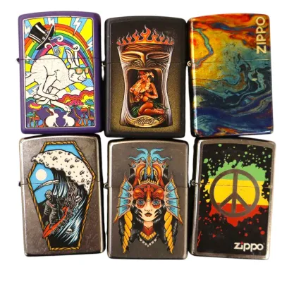 Sale Photo Thumbnail #171: Collection of six modern graphic Zippo lighters featuring artistic designs including psychedelic, tiki, and peace symbol motifs.
