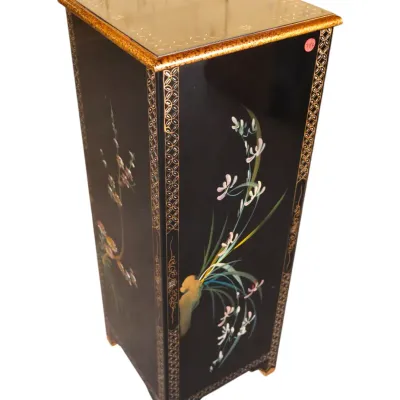 Sale Photo Thumbnail #248: Asian-style black lacquer display pedestal featuring hand-painted floral motifs, patterned gilt borders, and a mirrored glass top insert.