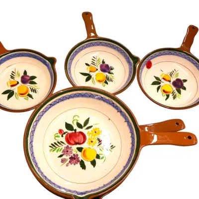 Sale Photo Thumbnail #282: Set of five hand-painted glazed ceramic pan-shaped serving dishes featuring colorful fruit motifs and brown handles.