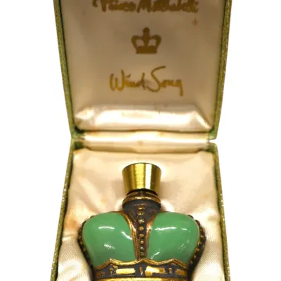 Sale Photo Thumbnail #294: Vintage Prince Matchabelli Wind Song perfume bottle in signature crown-shaped design, housed in its original satin-lined presentation box.
