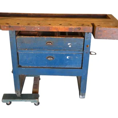 Sale Photo Thumbnail #242: Vintage heavy-duty woodworking workbench with a thick maple top, integrated metal vise, end vise, and a blue painted base with storage drawers.